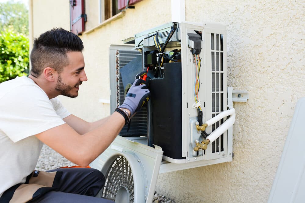 Man | Cleaning Your Air Conditioner | Bulldog Adjusters